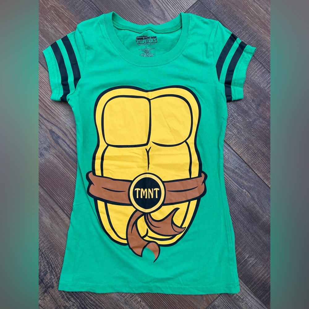 Women’s size small ninja turtle costume shirt with shell and cape.